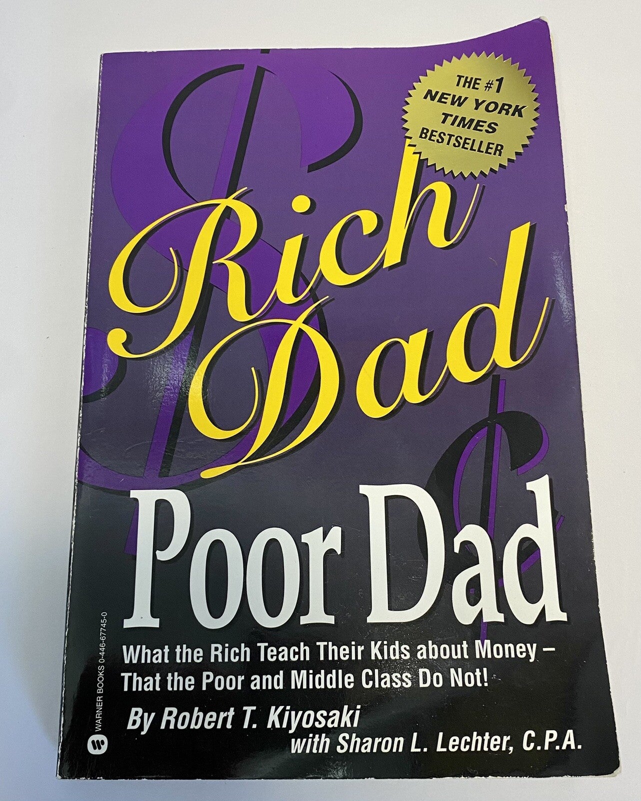 Rich Dad, Poor Dad by Robert T. Kiyosaki and Sharon L. Lechter - GOOD