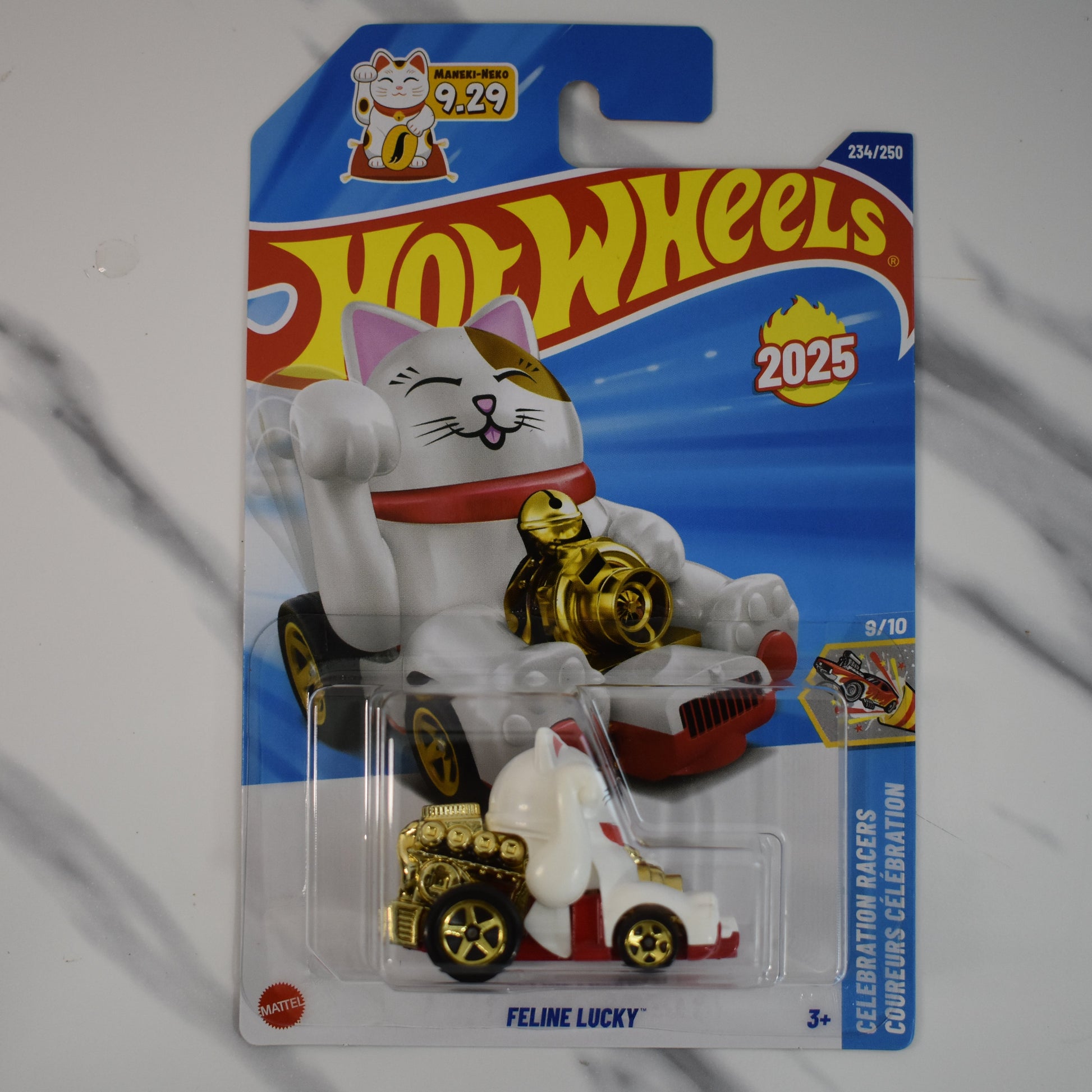 Hot Wheels Feline Lucky cat toy figure in packaging on a gray background